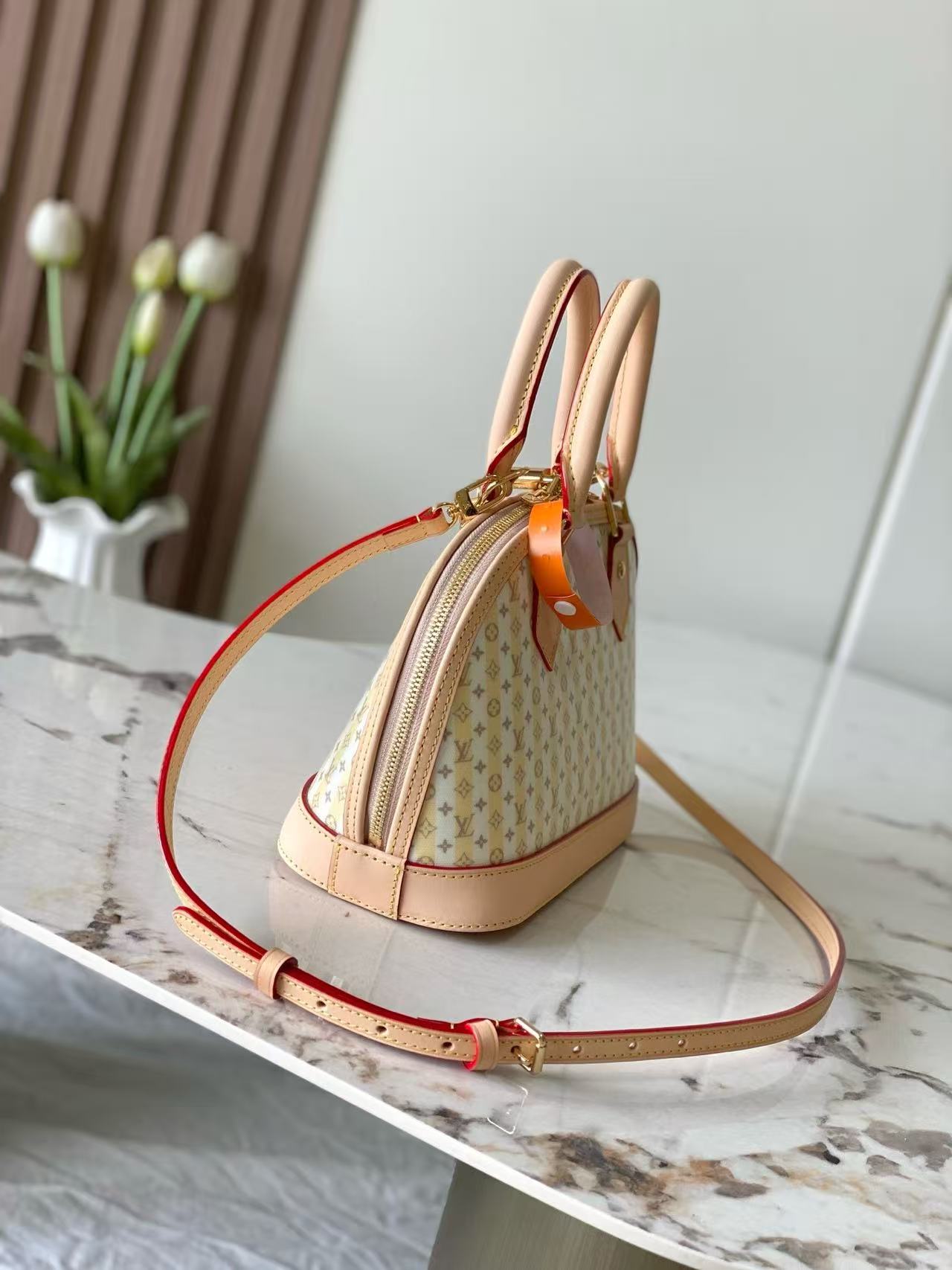 This LV Stamp series Alma BB handbag