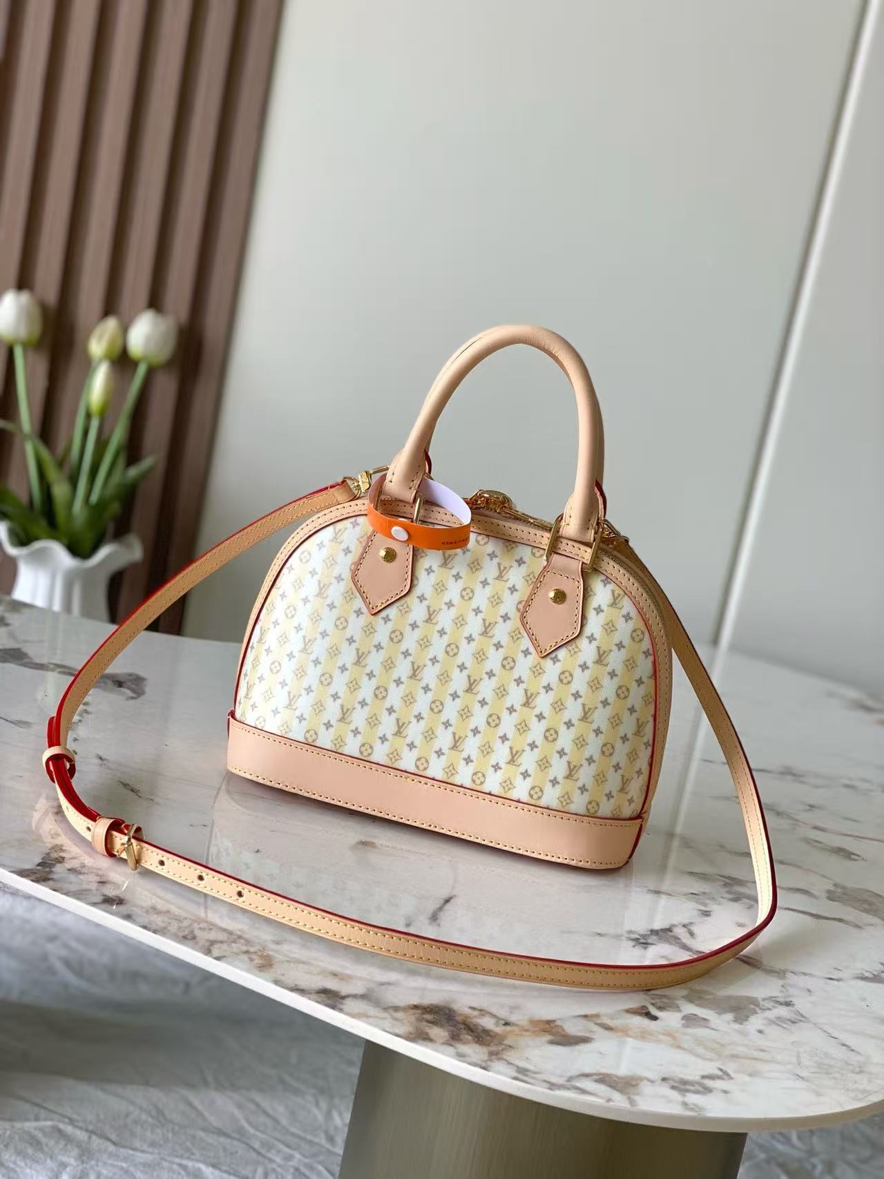 This LV Stamp series Alma BB handbag